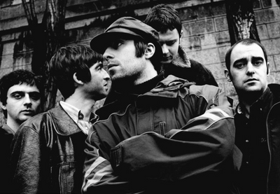 Oasis, Liam Gallagher, Noel Gallagher, Paul Arthurs, Paul McGuigan, Alan White, ‘Posing in Paris’ © Jill Furmanovsky at Proud Galleries London