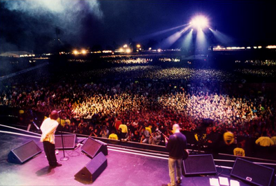 Oasis, Liam Gallagher, Paul Arthurs, ‘At Knebworth Park, Live on Stage, Colour’ © Jill Furmanovsky at Proud Galleries London