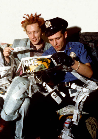 The Clash, Sex Pistols, Johnny Rotten, Paul Simonon, ‘Tearing NME’ © Adrian Boot at Proud Galleries