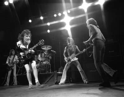 AC/DC, Bon Scott, Angus Young, Malcolm Young, Rob Bailey, Peter Clack 'AC/DC, Live on Stage at the Hammersmith Odeon' © Steve Joester at Proud Galleries London