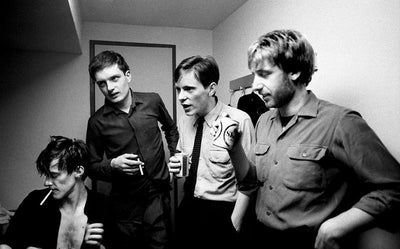 Joy Division, Ian Curtis, Bernard Sumner, Peter Hook, Stephen Morris, ‘At YMCA, Backstage’© Jill Furmanovsky at Proud Galleries London