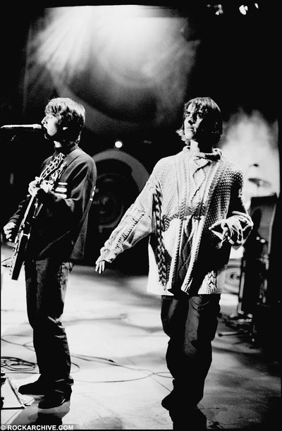 Oasis, Liam Gallagher, Noel Gallagher, ‘At Knebworth Park, Live on Stage’ © Jill Furmanovsky at Proud Galleries London
