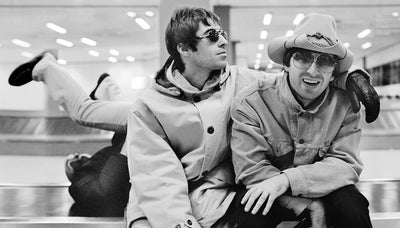 Oasis, Liam Gallagher, Noel Gallagher, ‘At Schiphol Airport’ © Jill Furmanovsky at Proud Galleries London