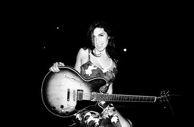 Amy Winehouse, ‘With Guitar’ © Charles Moriarty at Proud Galleries London