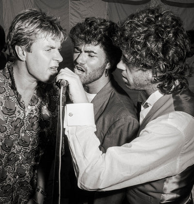 George Michael, Bob Geldof, ‘At Bob Geldof and Paula Yates Wedding, Live on Stage’ © Brian Aris at Proud Galleries London