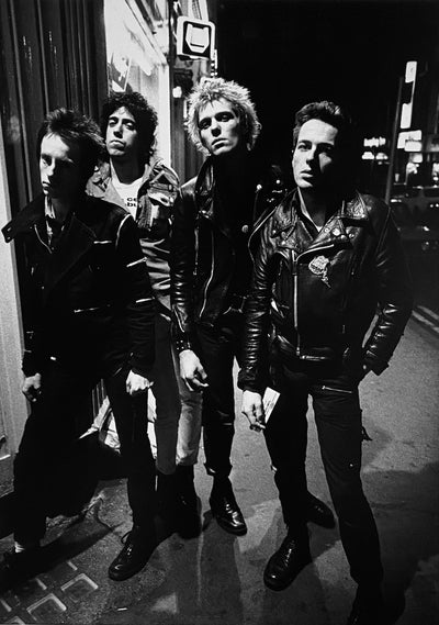 The Clash, Topper Headon, Joe Strummer, Mick Jones, Paul Simonon, ‘Leicester Square’ © Adrian Boot at Proud Galleries