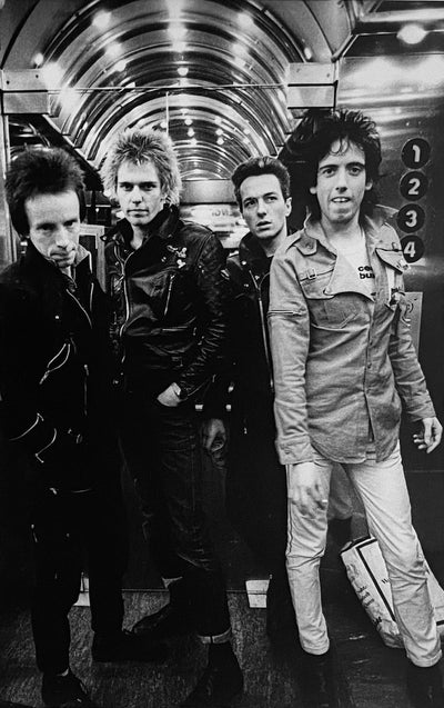The Clash, Topper Headon, Joe Strummer, Mick Jones, Paul Simonon, ‘Leicester Square No.II’ © Adrian Boot at Proud Galleries