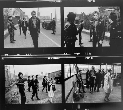 The Clash, Topper Headon, Joe Strummer, Mick Jones, Paul Simonon, ‘Strolling the Streets After Cancelled Tour, Contact Sheet’ © Adrian Boot at Proud Galleries