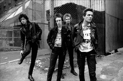 The Clash, Topper Headon, Joe Strummer, Mick Jones, Paul Simonon, ‘Strolling the Streets After Cancelled Tour, No.II’ © Adrian Boot at Proud Galleries